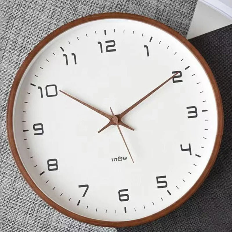 Brown minimalist wooden wall clock close-up with white face