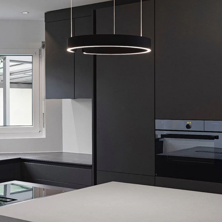 Close-up of the modern ring pendant light showing the sleek metal finish and integrated LED strip.