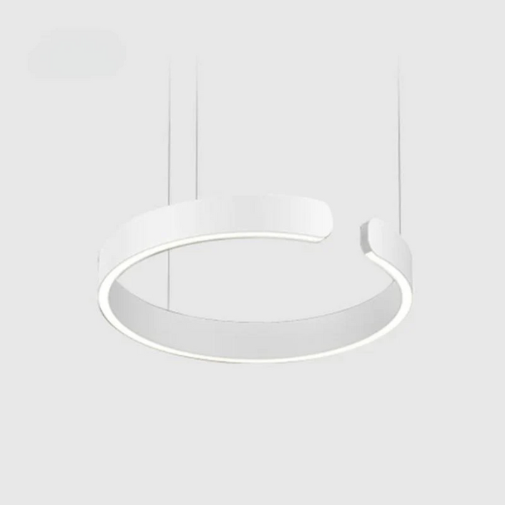 Modern circle LED pendant light hanging over a dining table, showcasing contemporary interior lighting design.