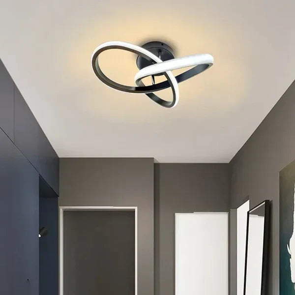 Modern lighting fixture glowing brightly, showcasing its stylish double ring architecture