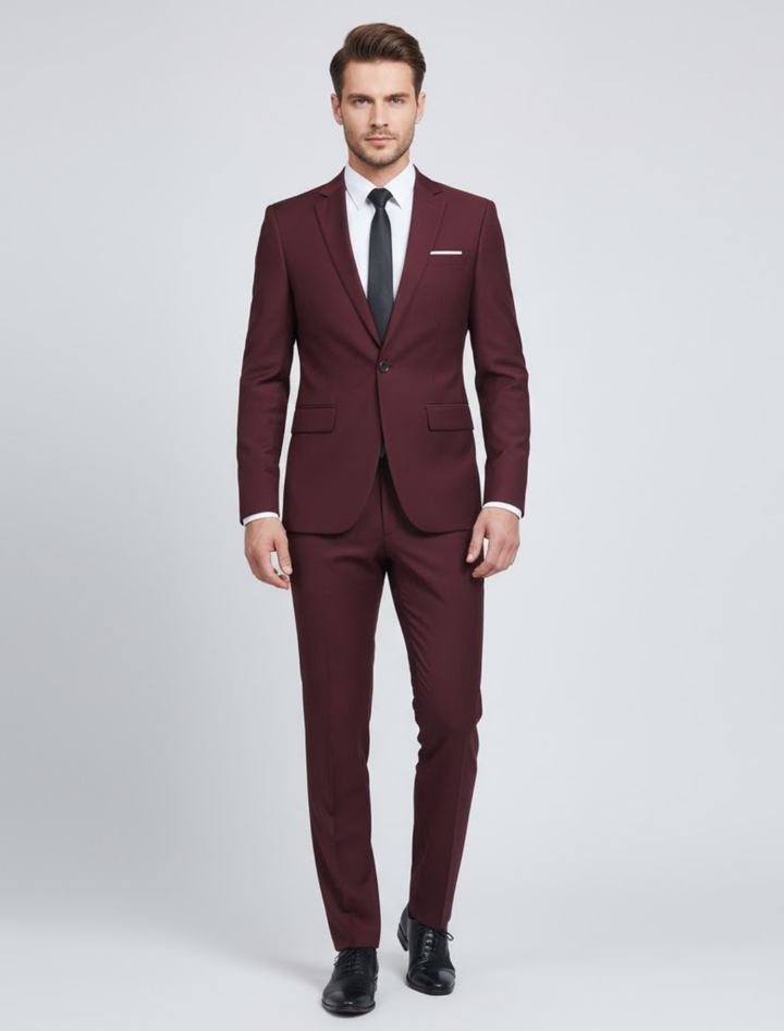 Man wearing a wine red modern fit two-piece suit with white shirt and dark tie