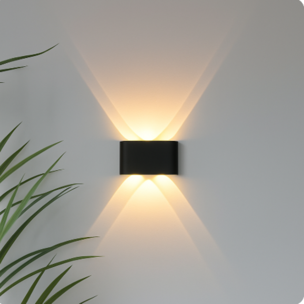 Sleek compact black LED wall lamp casting upward and downward illumination