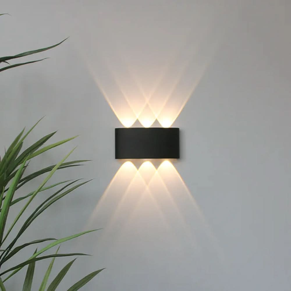 Minimalist LED fixture glowing softly in a hallway as contemporary indoor lighting decor