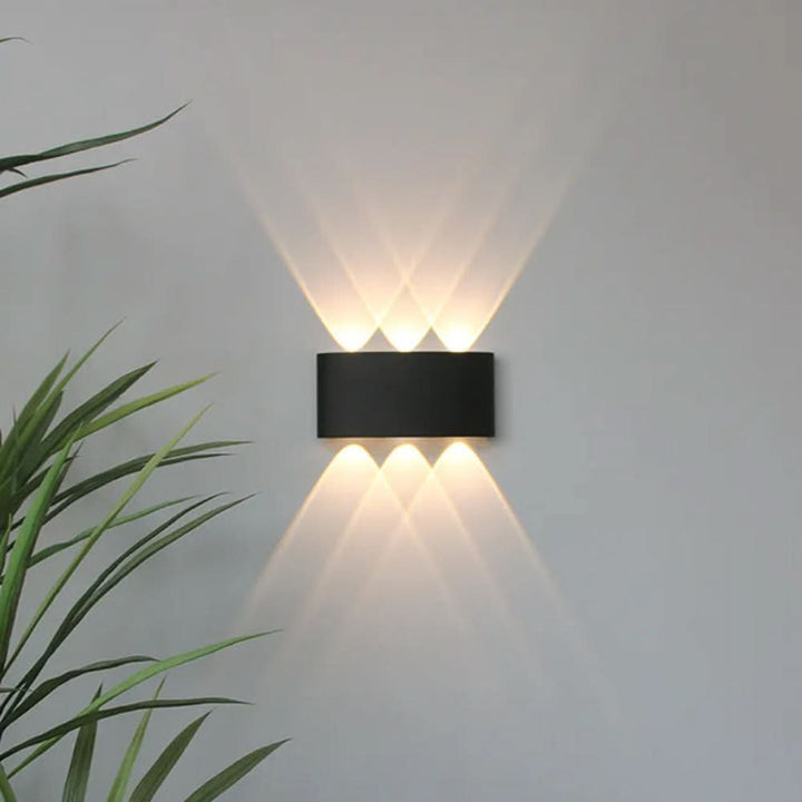 Minimalist LED fixture glowing softly in a hallway as contemporary indoor lighting decor