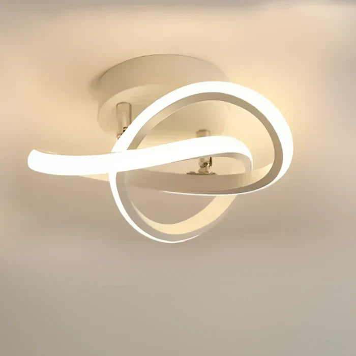 Contemporary double ring lighting fixture casting bright glow in interior space