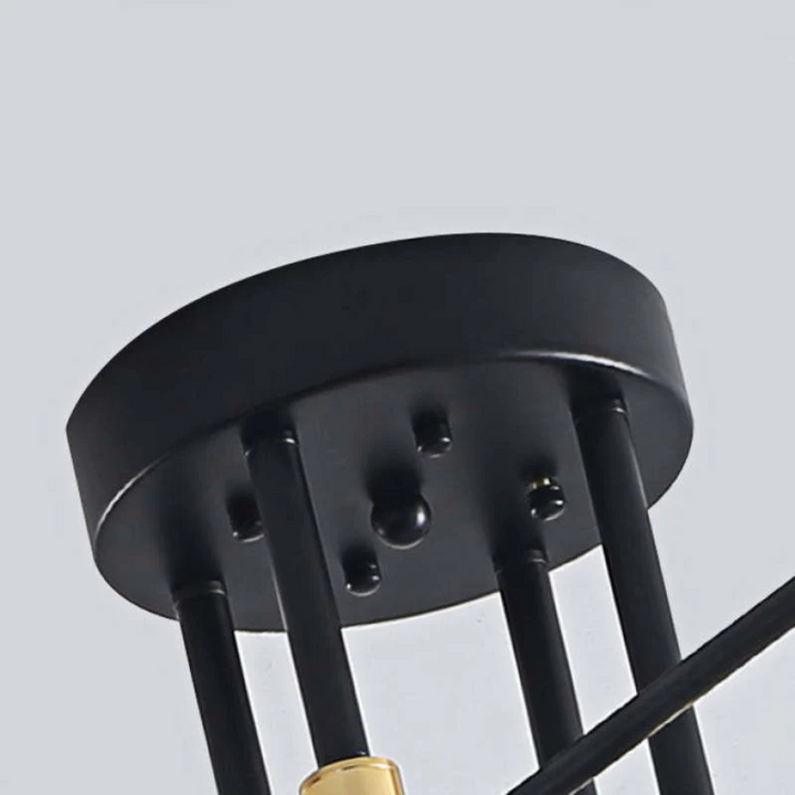Close-up of the black circular ceiling mount and suspension rods
