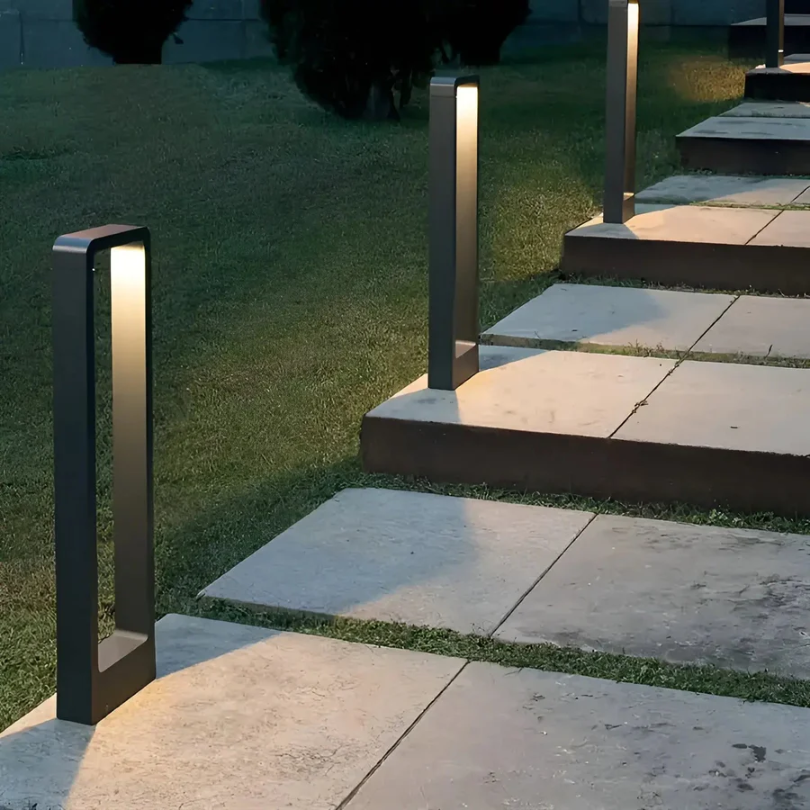 Sleek LED garden light columns placed strategically along outdoor stone steps