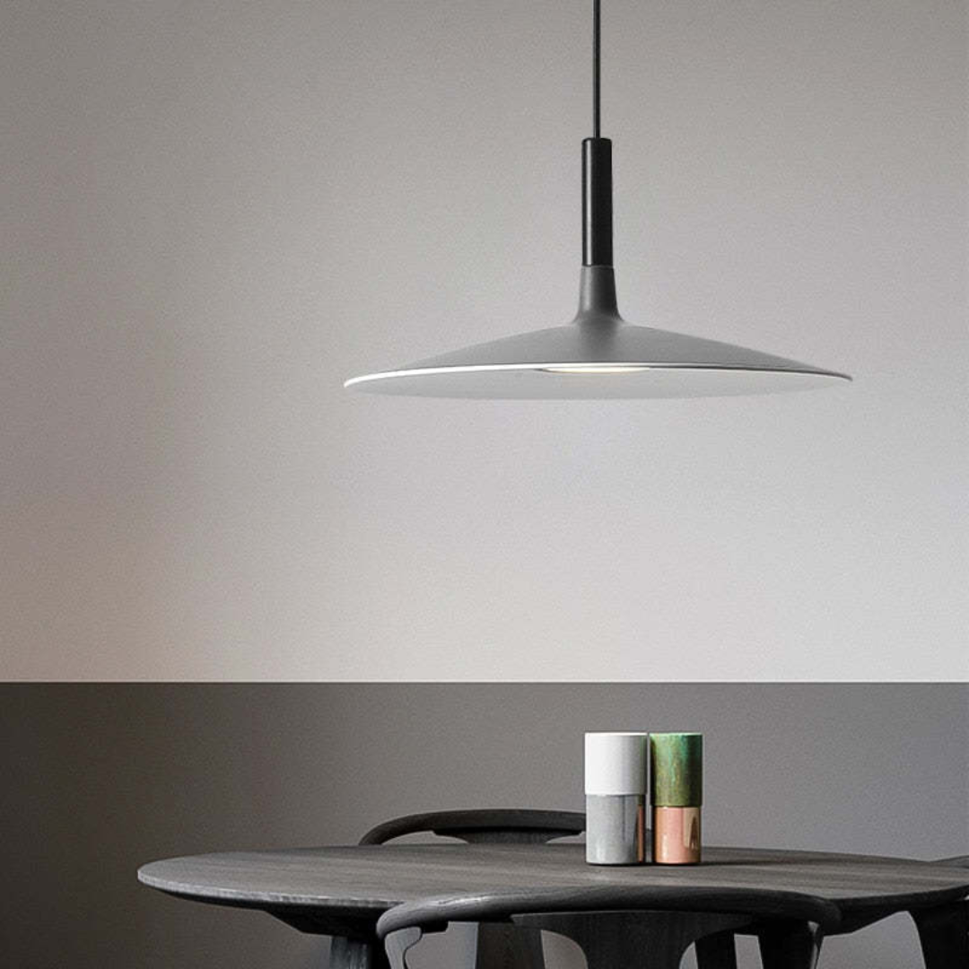 Illuminated LED ceiling lamp centered in a contemporary living space as ambient home decor.