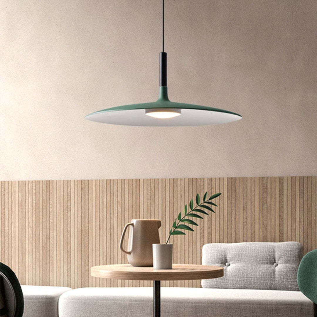 Modern LED pendant light fixture hanging against a neutral wall, showcasing minimalist home decor style.