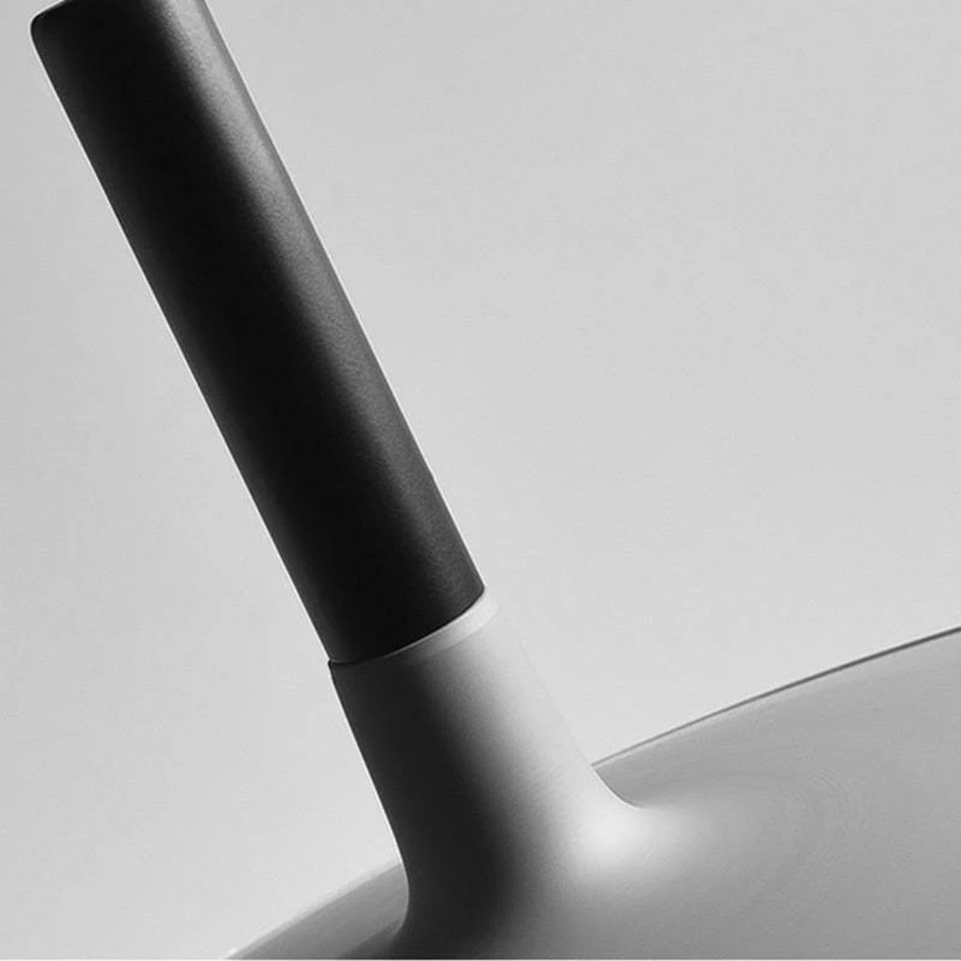 Contemporary hanging lamp illuminated in a stylish dining room setting for modern lighting inspiration.