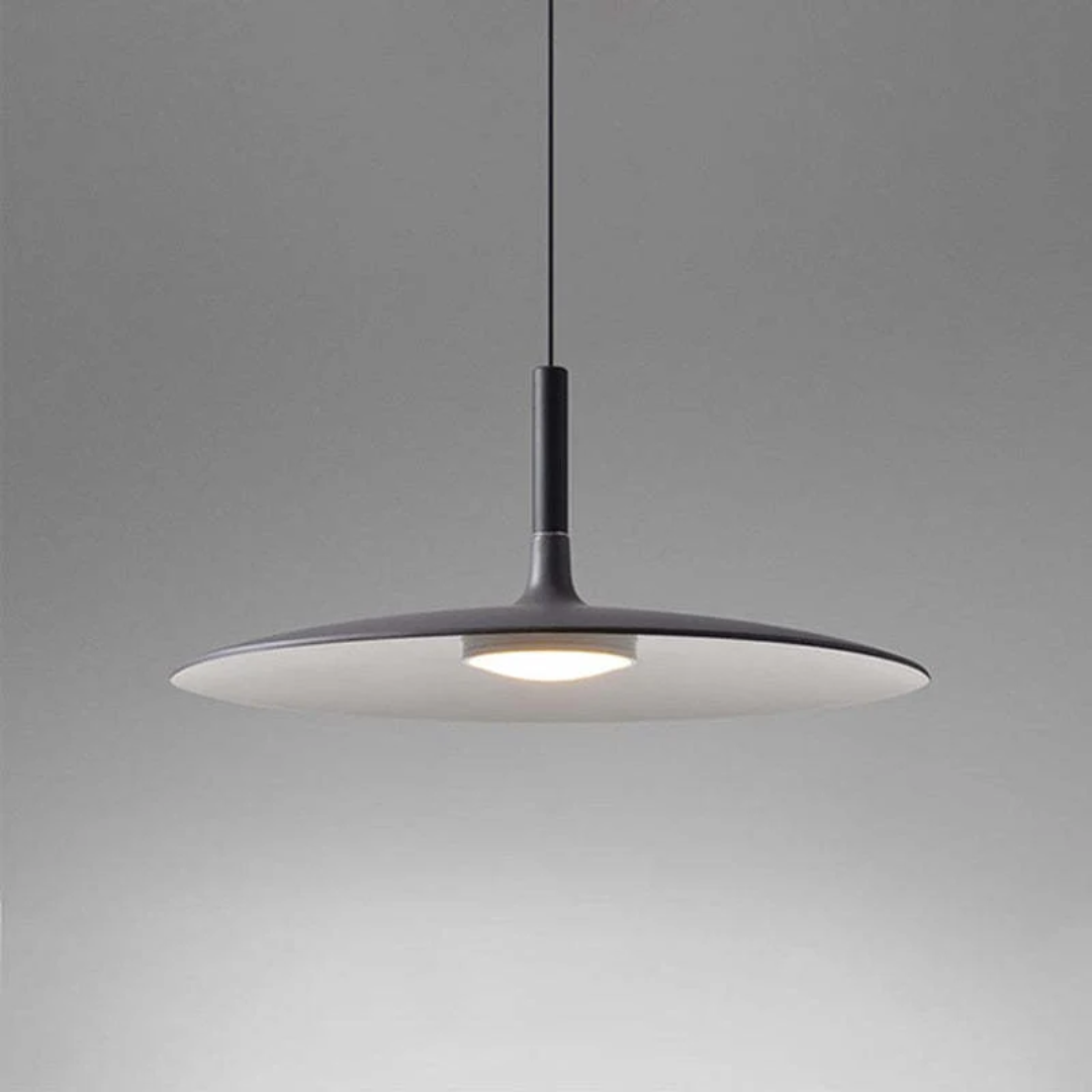 Minimalist light fixture casting a soft glow, perfect for modern home decor and interior styling.
