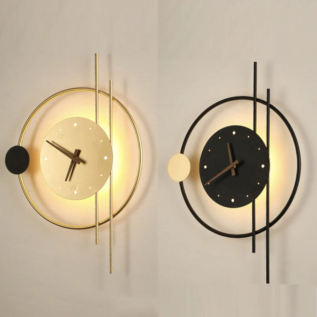 Gold and black modern LED wall clock lamps displayed side by side on a neutral wall.