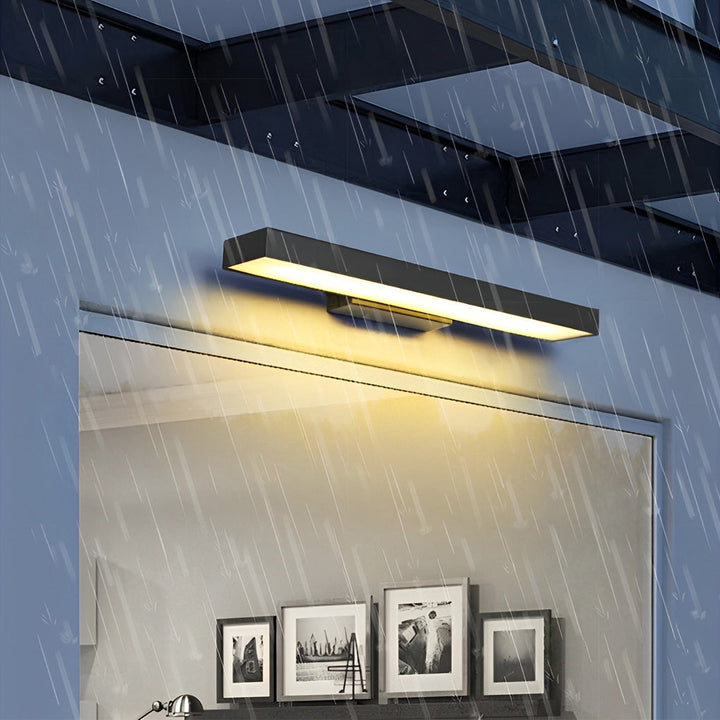 Water-resistant modern LED wall lamp installed outdoors during rainfall