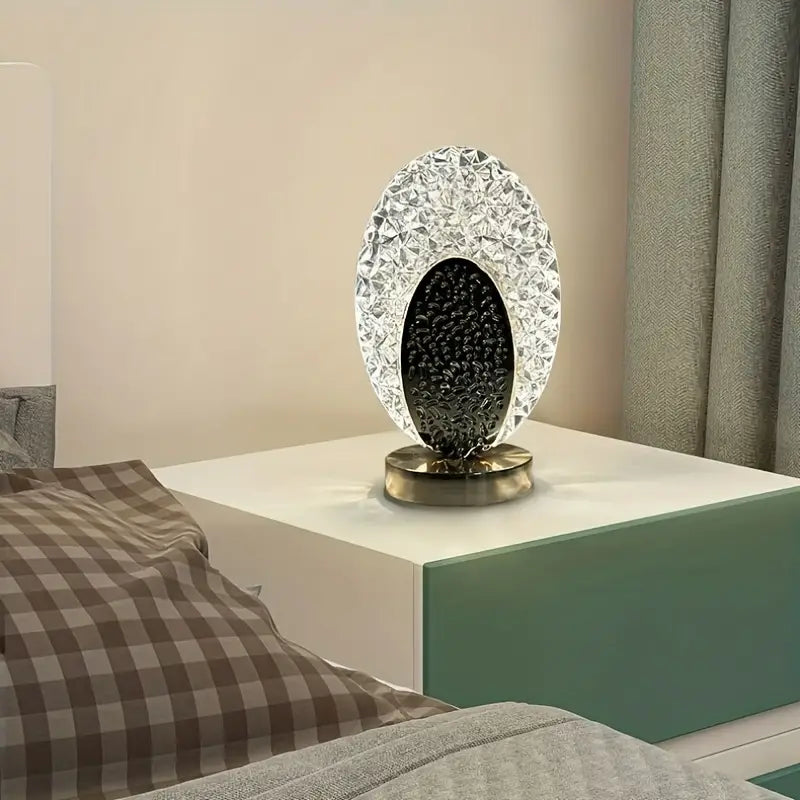 Cordless peacock desk lamp lit up in a dark room highlighting luxury home decor lighting
