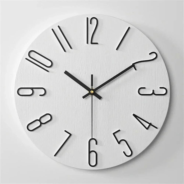Minimalist white wall clock featuring bold black numerals and clean hands
