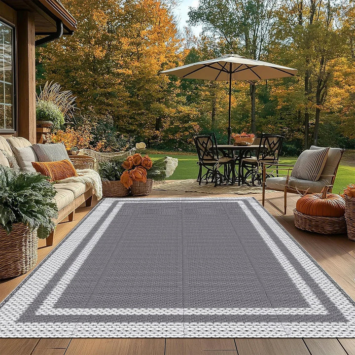 Stylish gray and white patio mat in a modern backyard setup