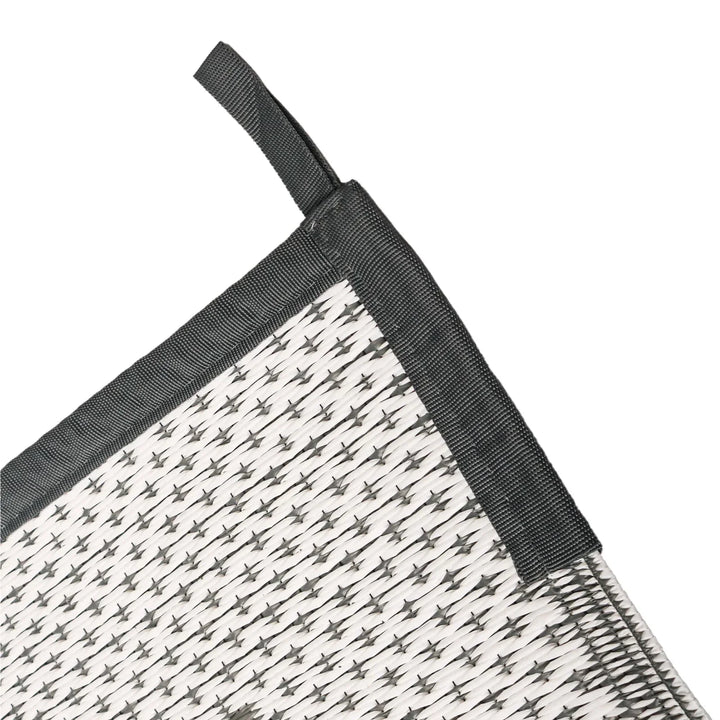 Reversible patio mat showing modern geometric design close-up