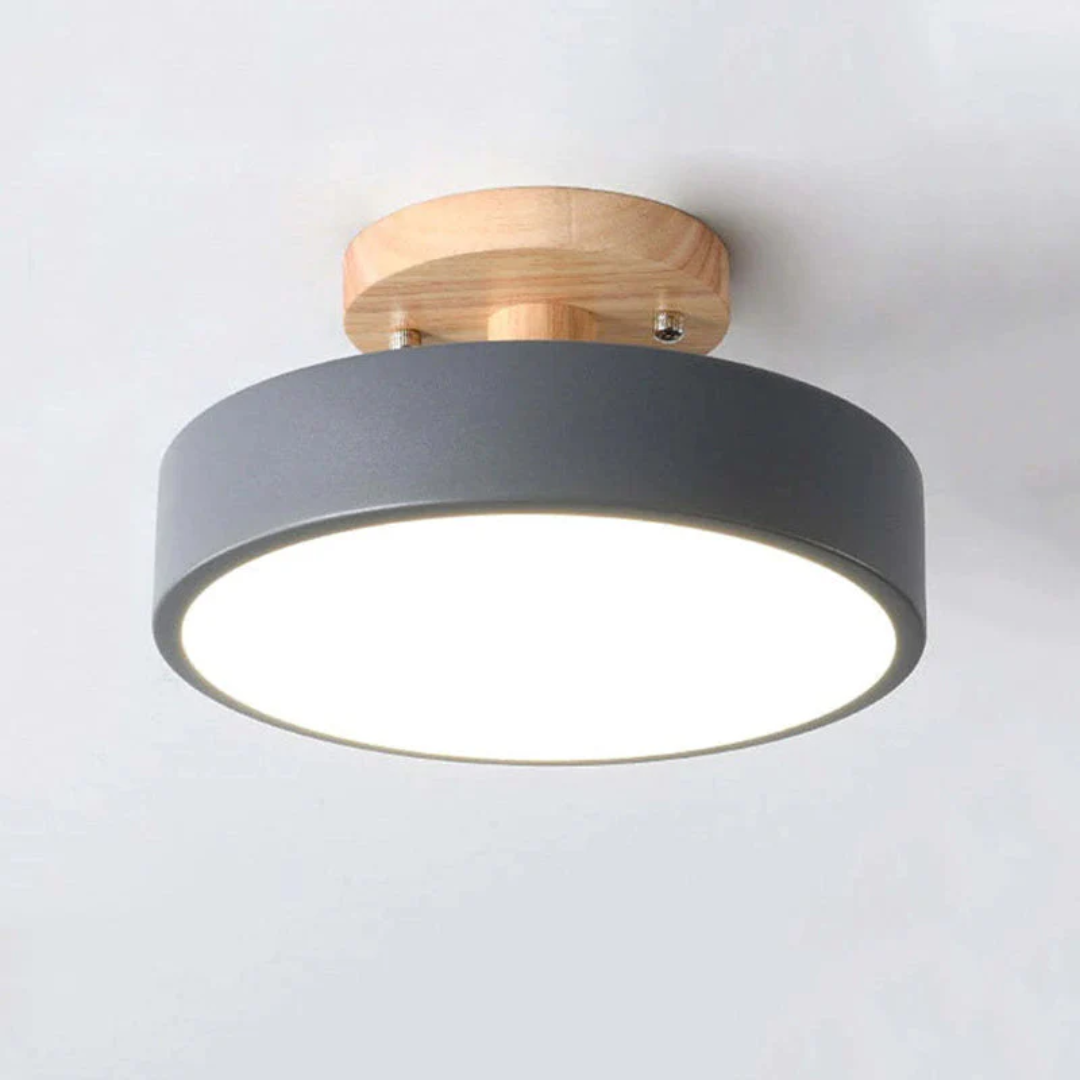 Detailed shot of the wooden trim on the modern round LED ceiling light