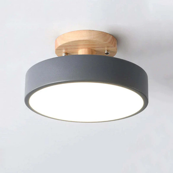 Detailed shot of the wooden trim on the modern round LED ceiling light