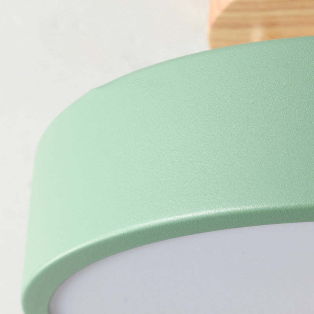 Detail shot showcasing the smooth matte green finish and acrylic diffuser