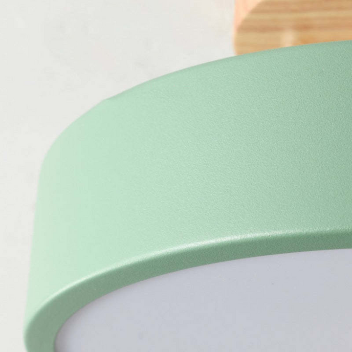 Detail shot showcasing the smooth matte green finish and acrylic diffuser