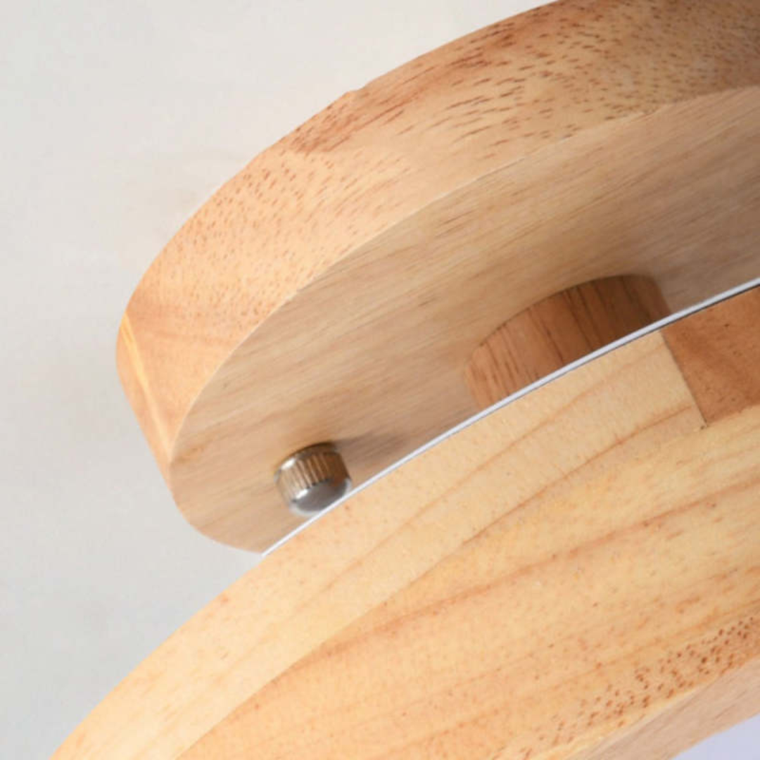 Close-up of the modern wooden ceiling lamp showing its sleek minimalist profile