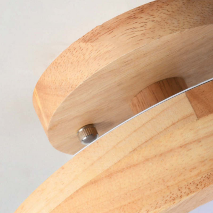 Close-up of the modern wooden ceiling lamp showing its sleek minimalist profile