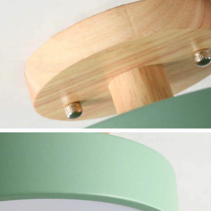 Close-up of the wooden ceiling mount and green shade of the modern LED light