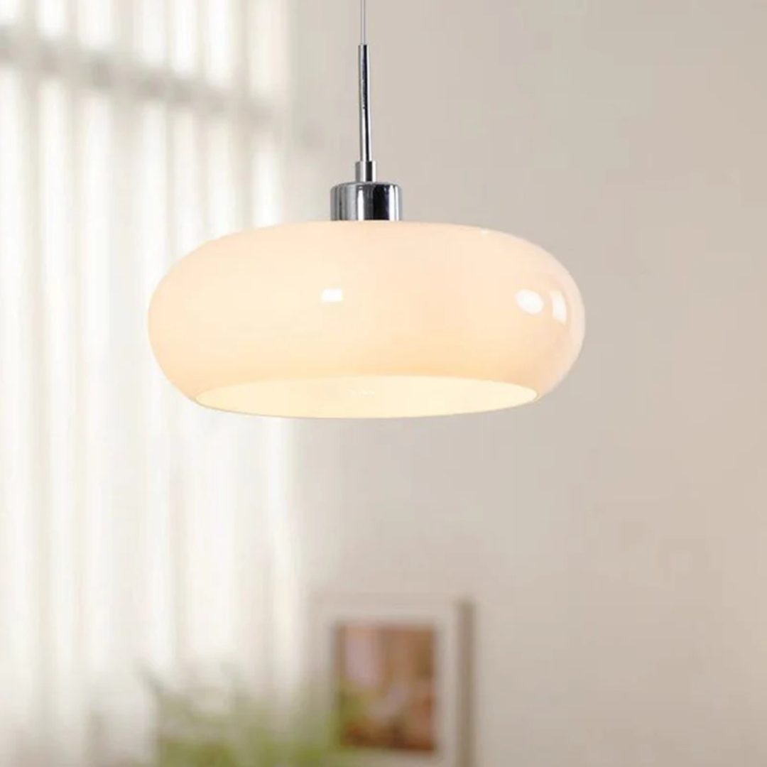 Elegant white round LED pendant light against a sheer curtain background