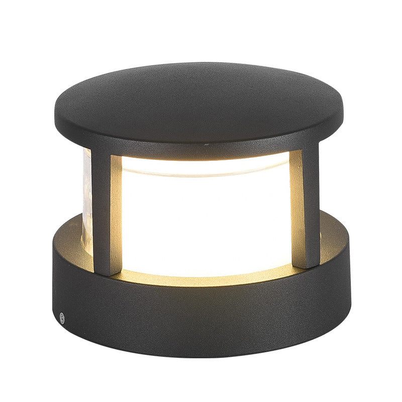 Close up view of circular modern outdoor post light with protective cover