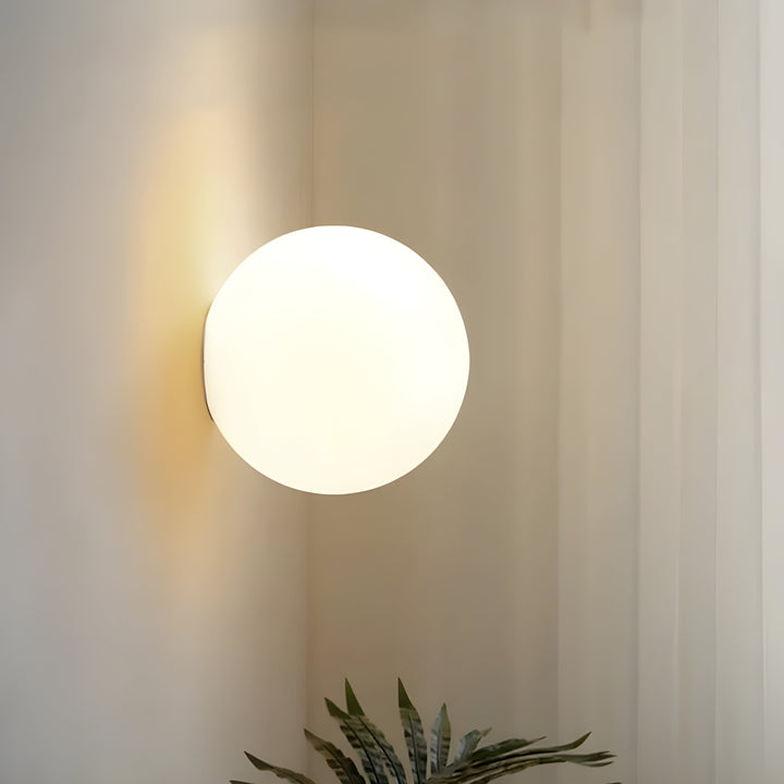 Side profile of the minimalist wall sconce showing its clean lines and mounting base