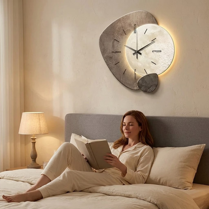 Glowing moon wall clock with soft LED backlighting, serving as a functional silent clock and home decor piece