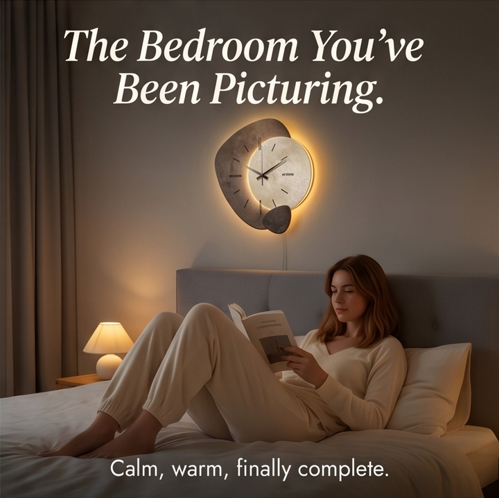 Side profile view of the slim lunar wall clock highlighting the warm LED backlight diffusion and clean frame