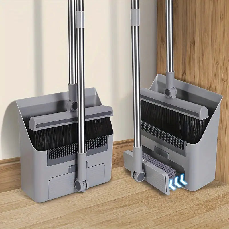 Gray multifunctional broom set standing upright with integrated dustpan