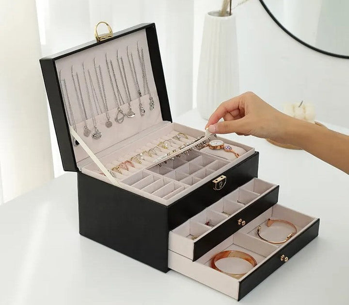 Detailed view of necklace hooks inside the jewellery box lid