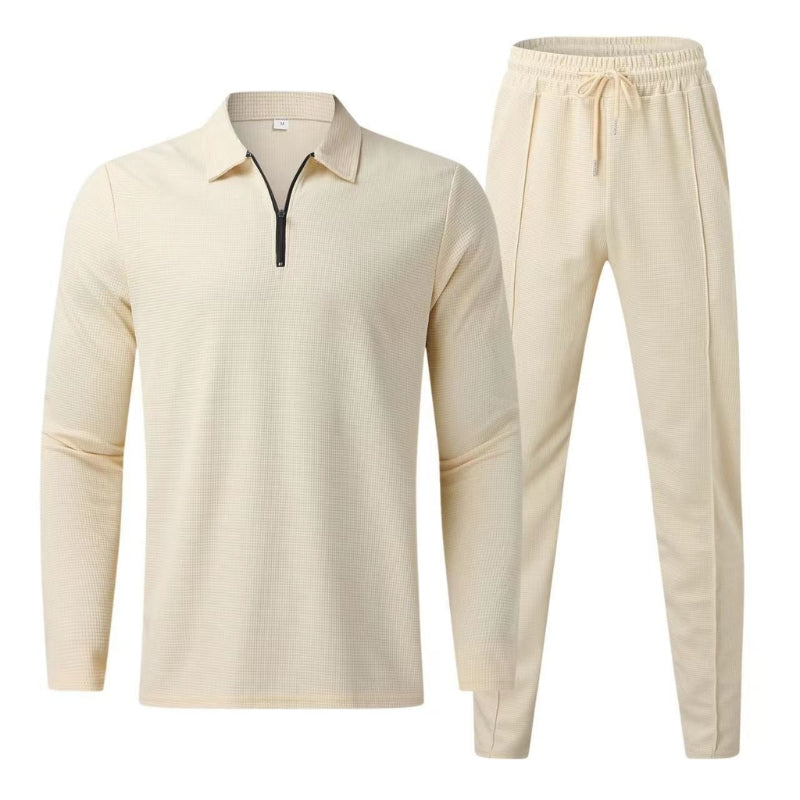 Flat lay of beige long sleeve polo top and matching jogger pants