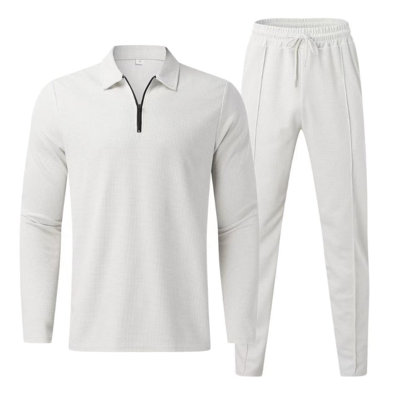 Full length shot of mens casual wear tracksuit set in neutral color palette