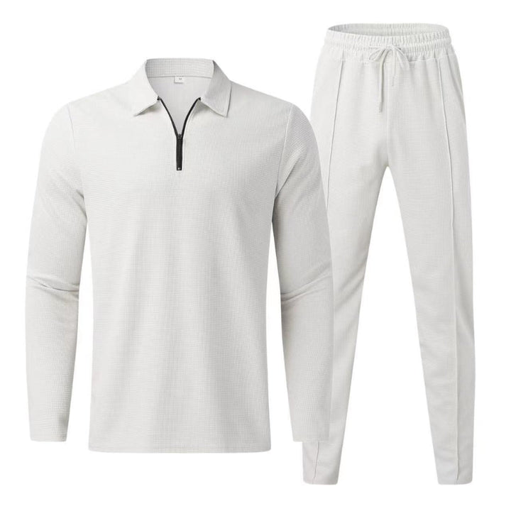 Full length shot of mens casual wear tracksuit set in neutral color palette