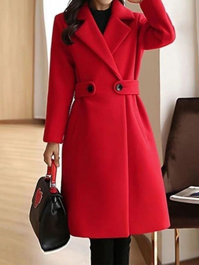 Detail shot of fabric texture and matching tie belt on womens stylish long winter outerwear coat