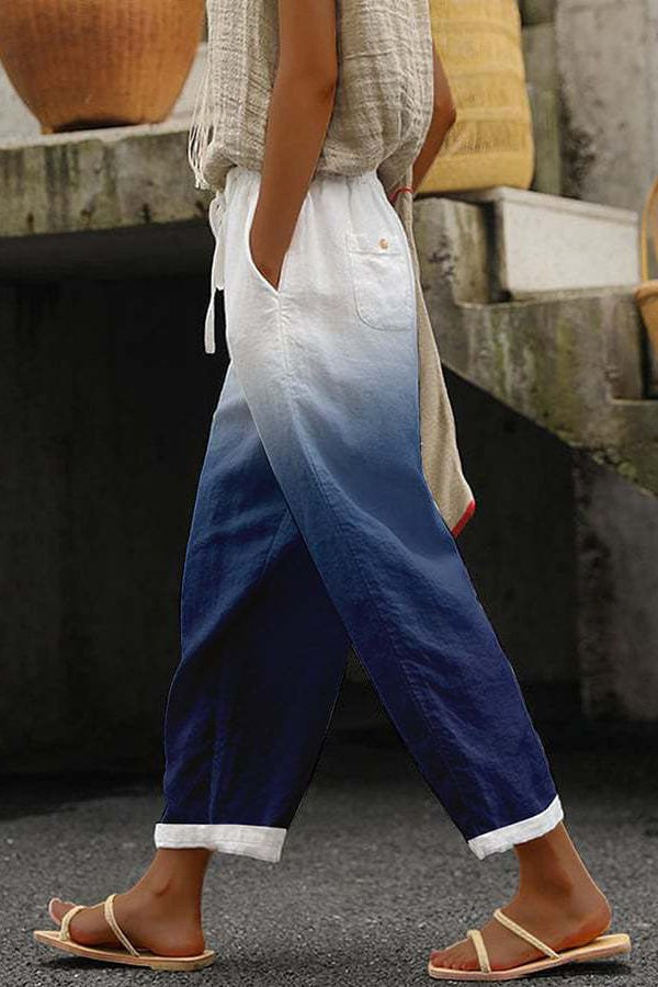Women wearing blue gradient tapered trousers with sandals