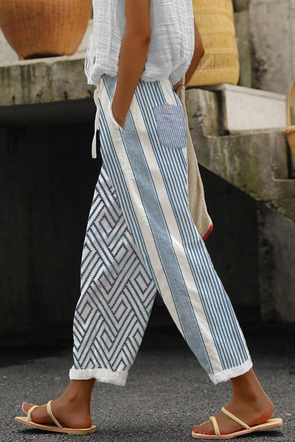 Women wearing striped patterned tapered trousers outdoors