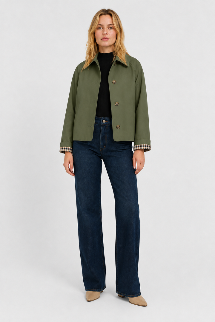 Side profile of relaxed fit transitional jacket in black