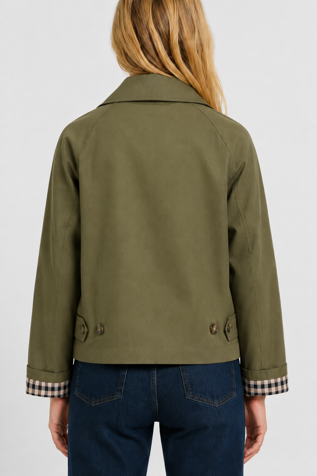Womens beige jacket showing collar and front pocket details