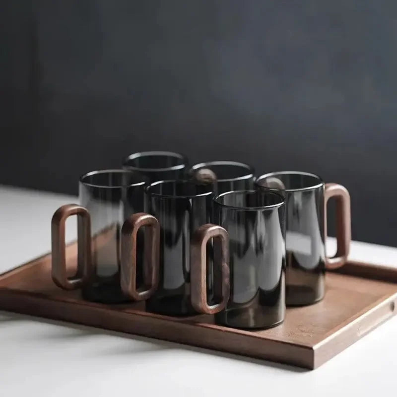 Clear borosilicate glass mug featuring a stylish wooden handle for tabletop drinkware
