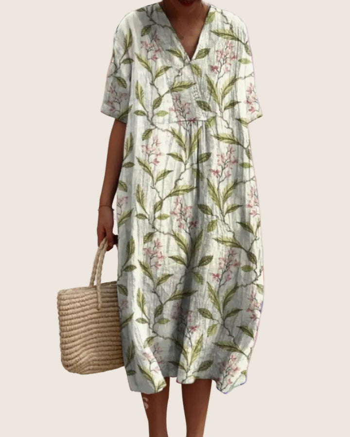 Detail view of V-neckline on women's floral midi dress