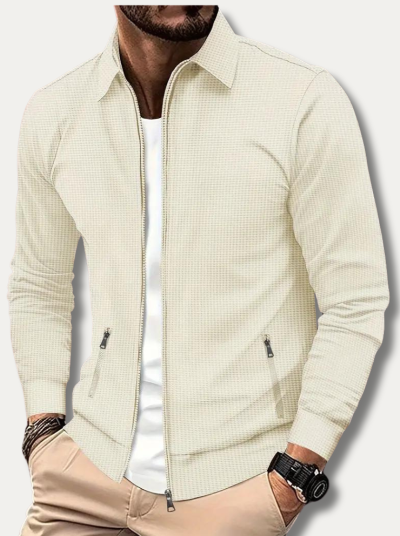 Man wearing beige classic track jacket with full zip and baseball collar