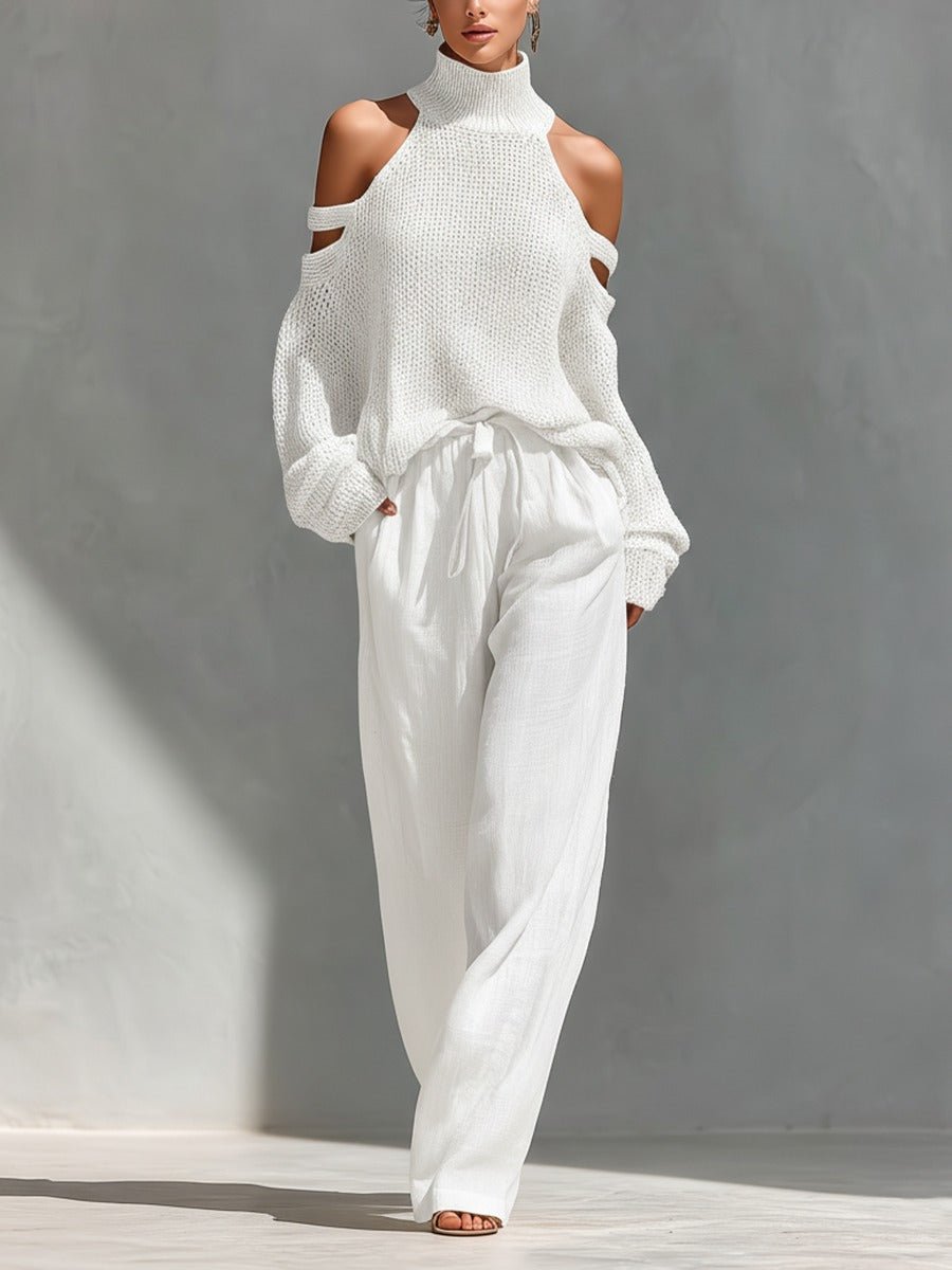 Woman wearing white off-shoulder two-piece set with wide-leg trousers