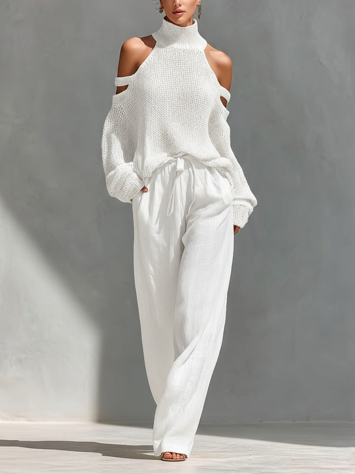 Woman wearing white off-shoulder two-piece set with wide-leg trousers