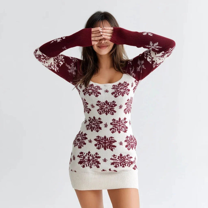 Woman wearing red and white patterned off-the-shoulder knit dress