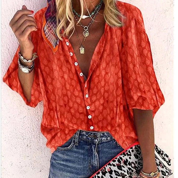 Close up of button front closure on womens summer holiday blouse shirt